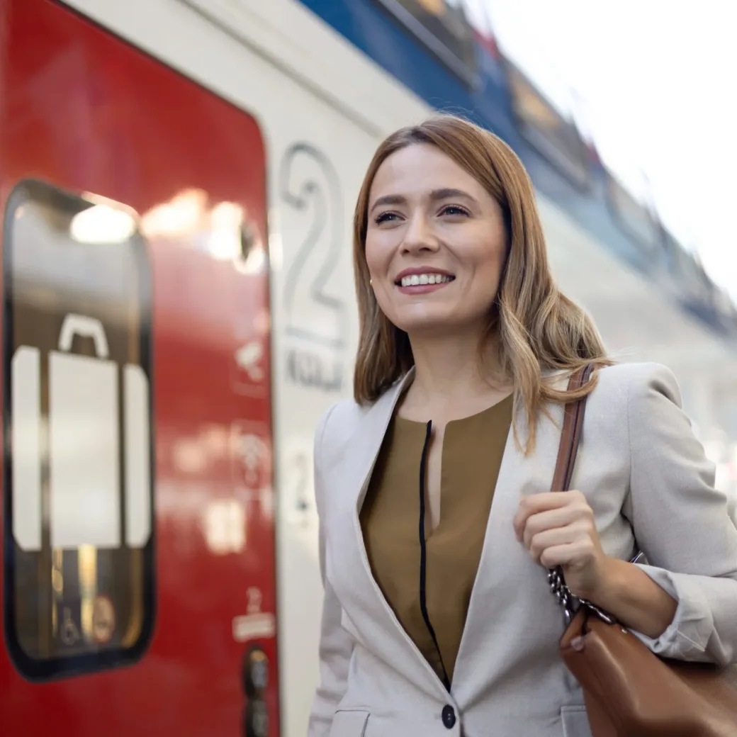 Young woman commuting to work by rail