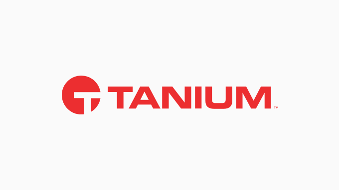 The red Tanium logo showcases a stylized "T" encircled beside the bold, uppercase word "Tanium," embodying the spirit of visionary global leadership.