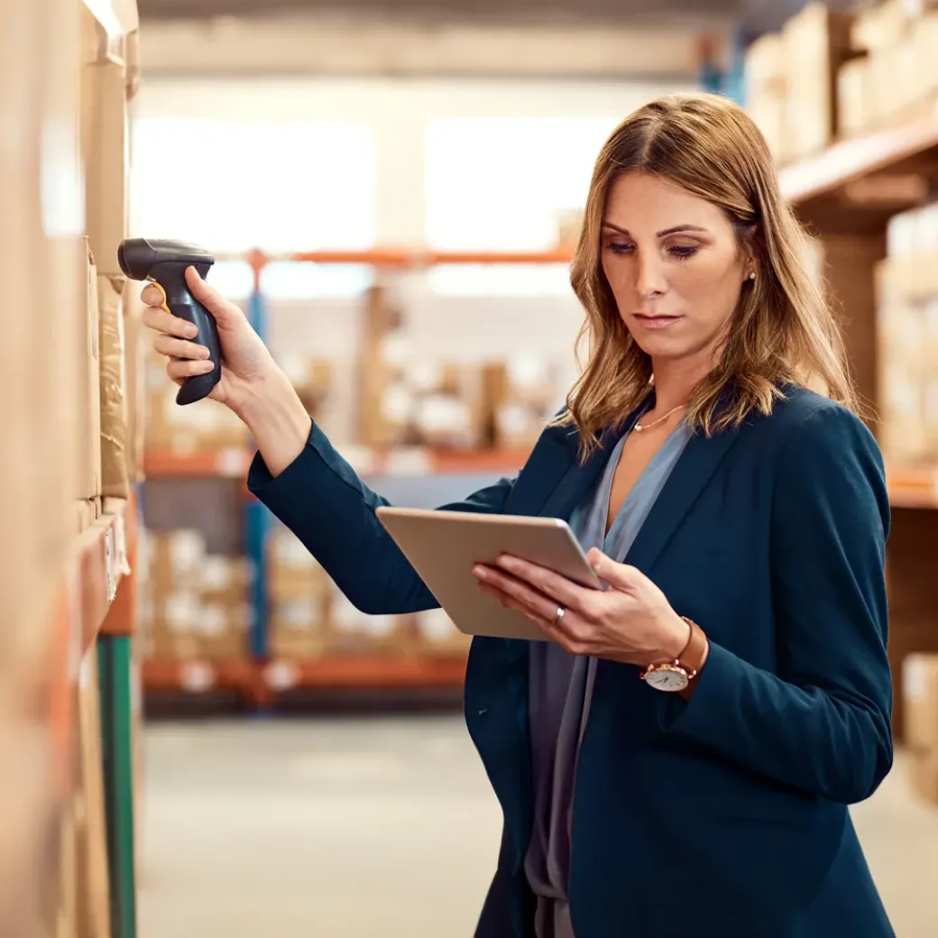 Shot of a young factory manager using a barcode reader and digital tablet in a warehouse