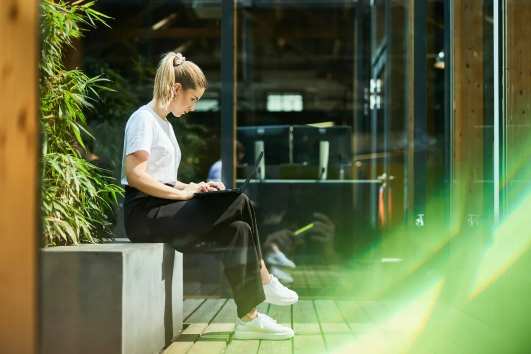 valantic employee looking at her laptop