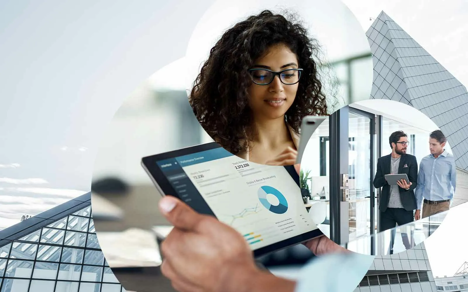 Edificio empresarial no fundo, tablet com software, pessoa a observar, pessoas a analisar, valantic