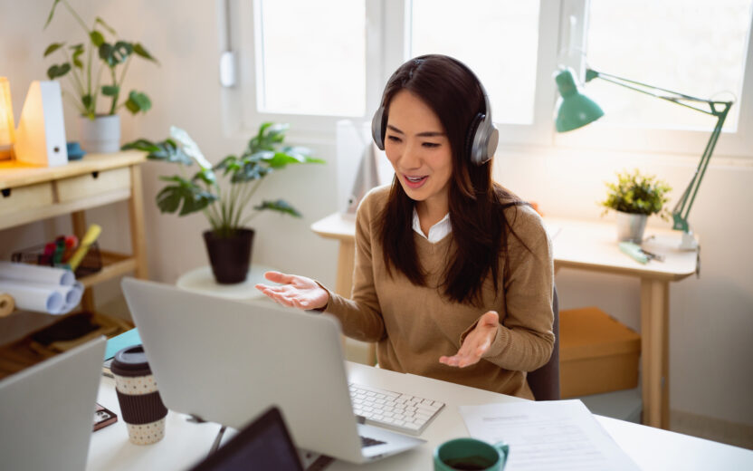 Businesswoman having a video conference at her office