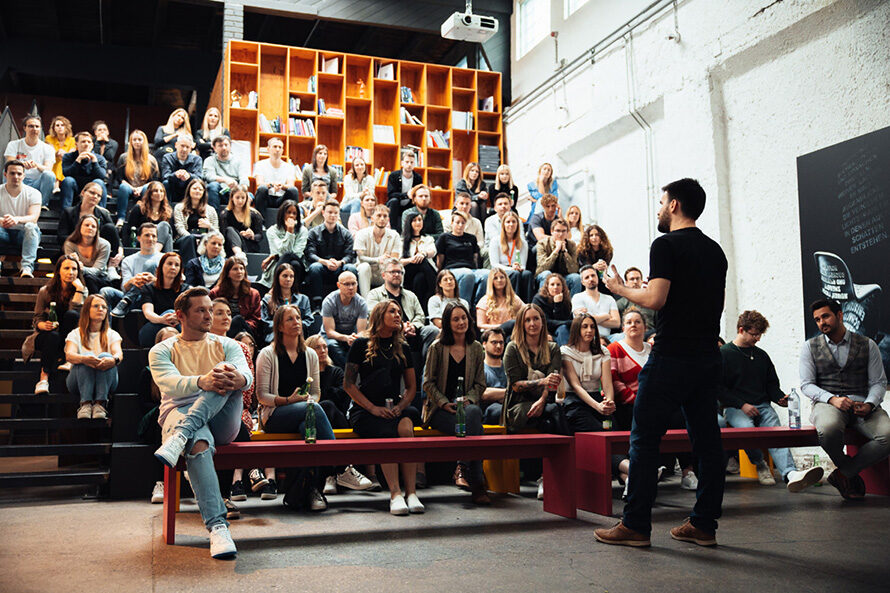 Employees listen to a lecture