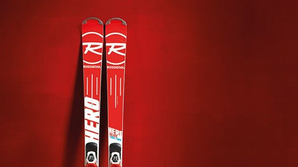 Red ski from rossignol in front of a red wall