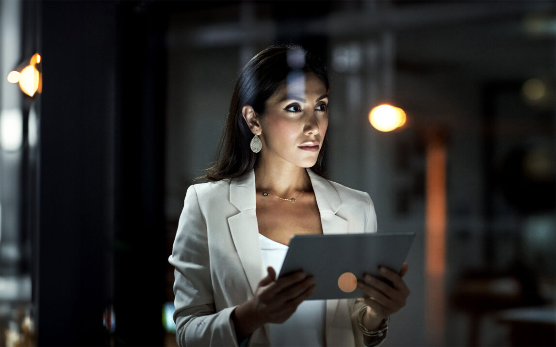 Shot of a young businesswoman using a digital tablet at work