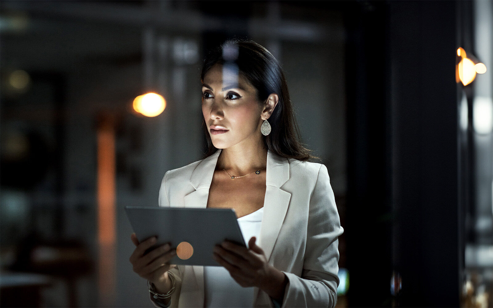 Shot of a young business woman using a digital tablet at work