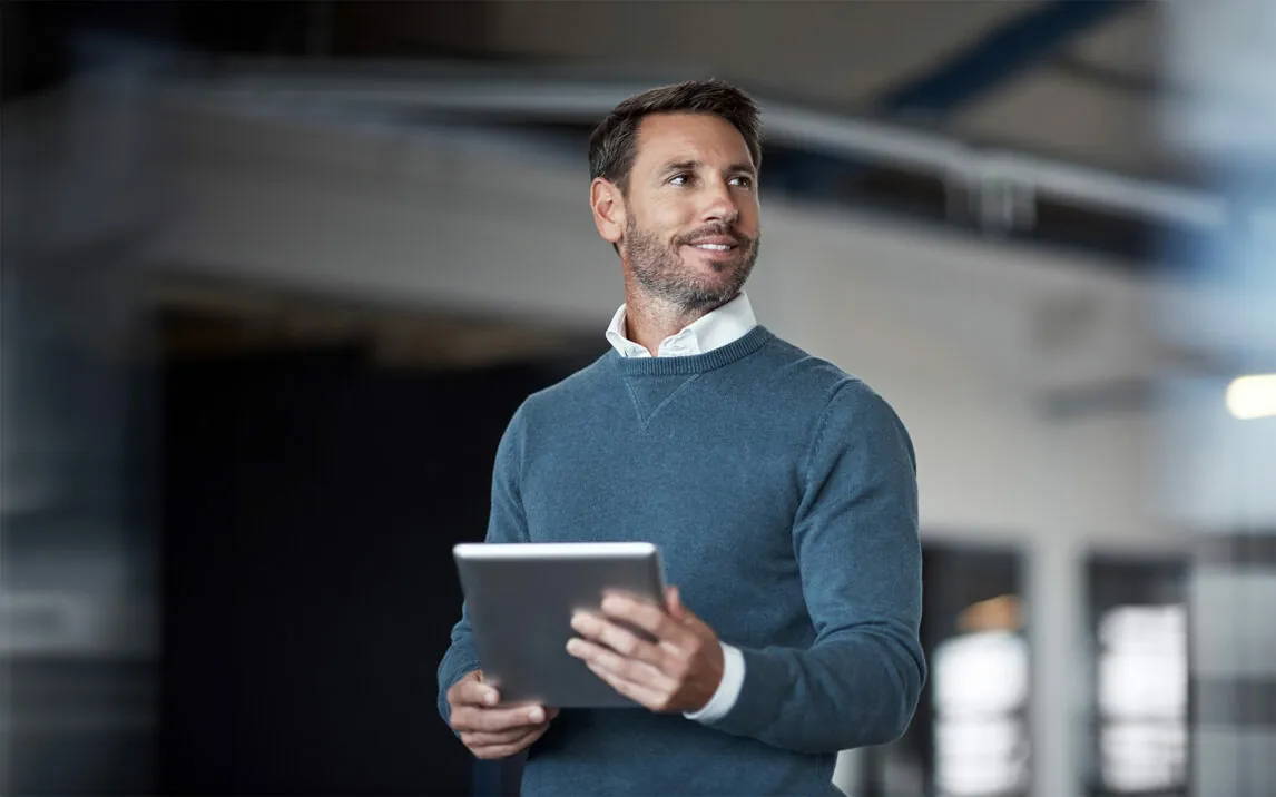 Cropped shot of a mature businessman working on his tablet in the office