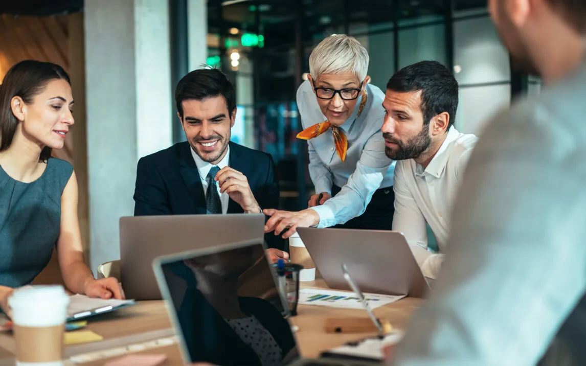 Modern business people discussing new business ideas during meeting in the office