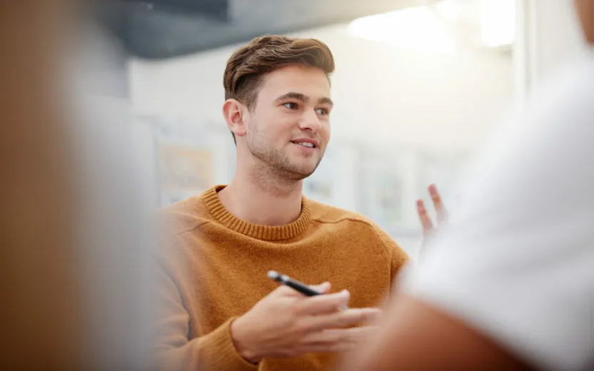 Shot of a mature businessman having a discussion with a colleague in an office