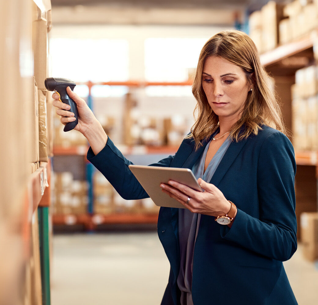 Shot of a young factory manager using a barcode reader and digital tablet in a warehouse