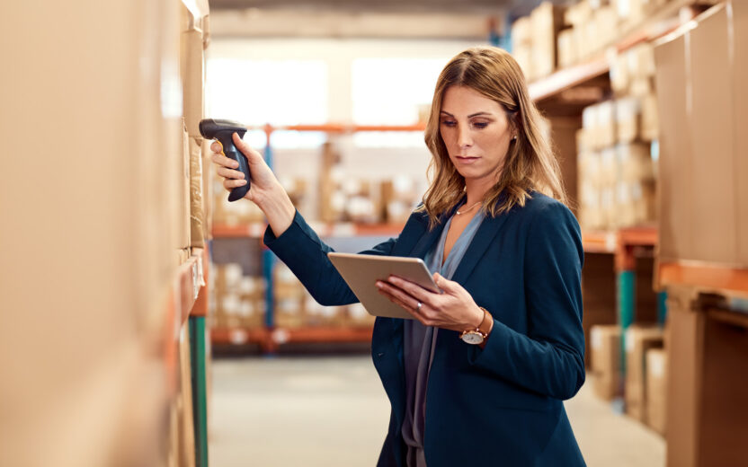 Shot of a young factory manager using a barcode reader and digital tablet in a warehouse