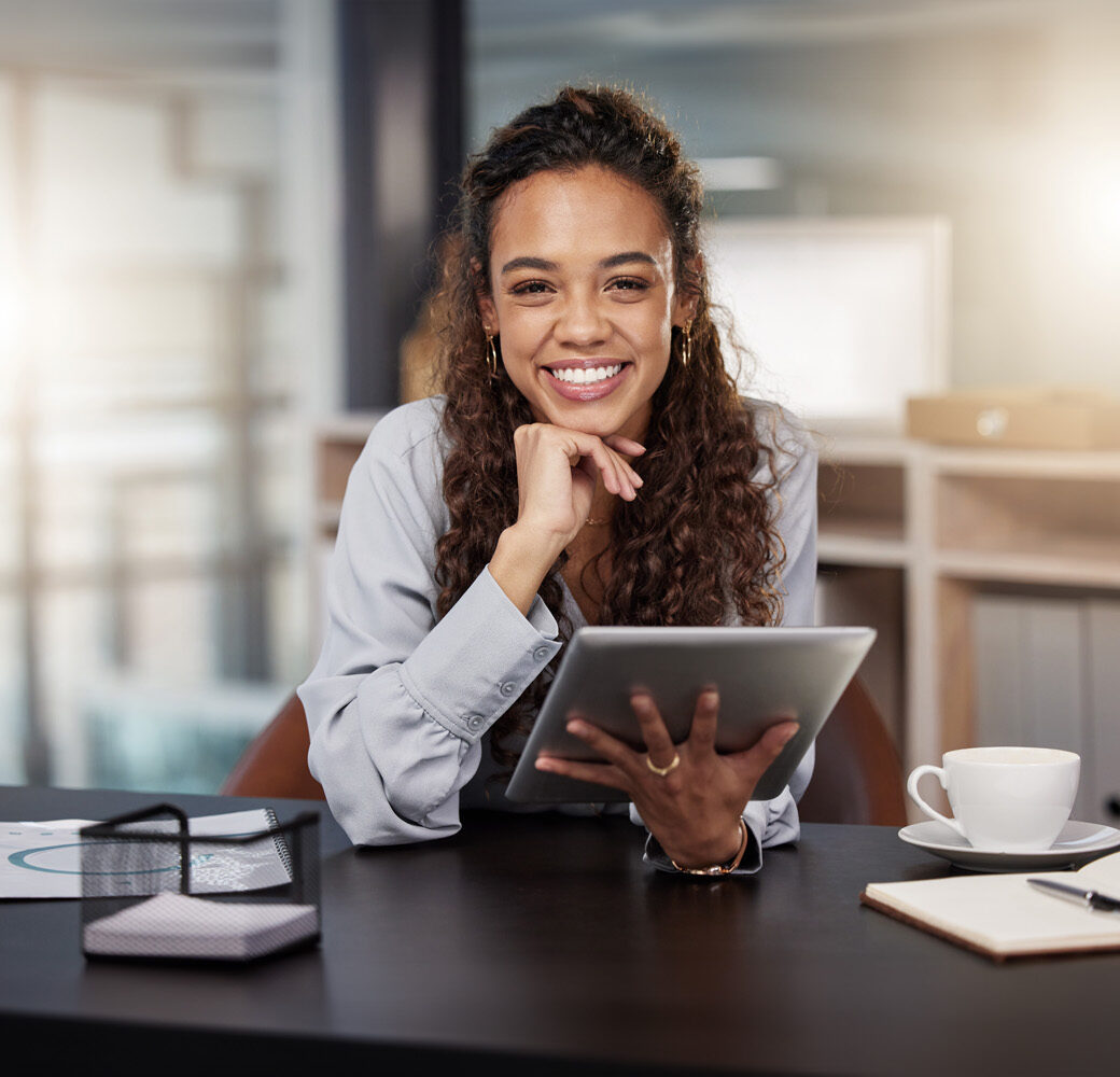 Shot of a young woman using a tablet at work