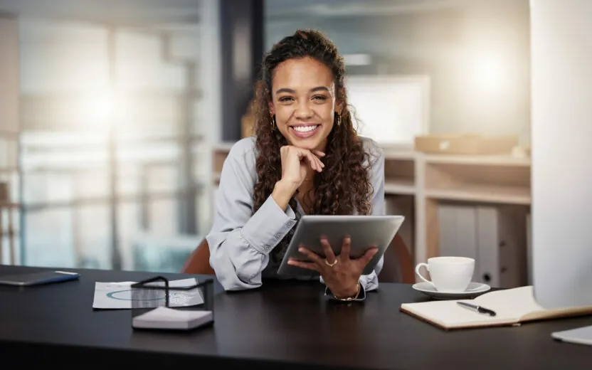 Shot of a young woman using a tablet at work