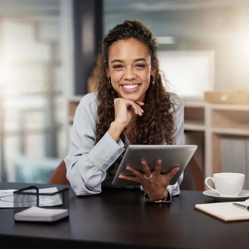 Shot of a young woman using a tablet at work