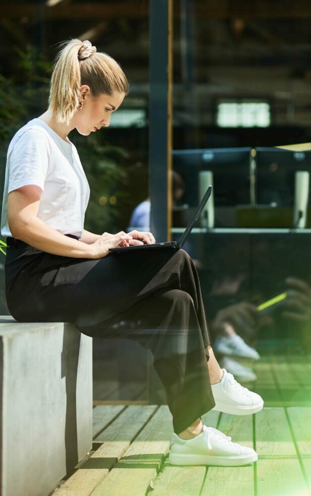 valantic employee working on laptop in Salzburg