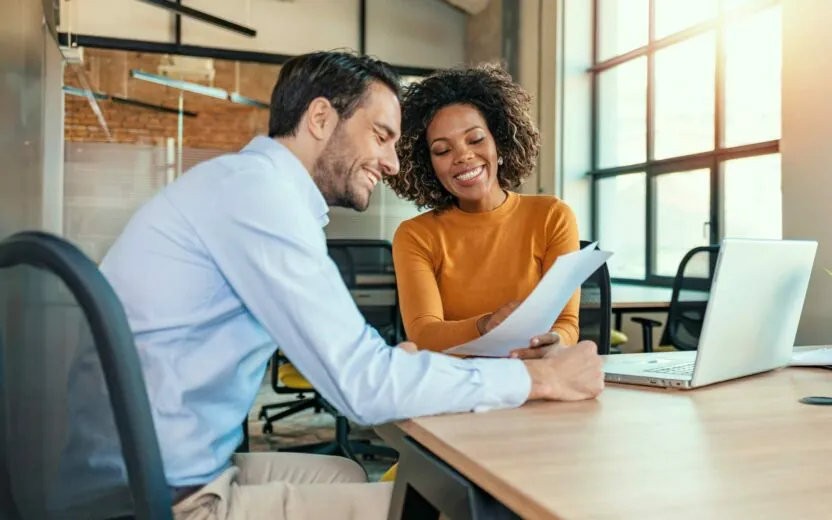 Two colleagues having a meeting in modern office.