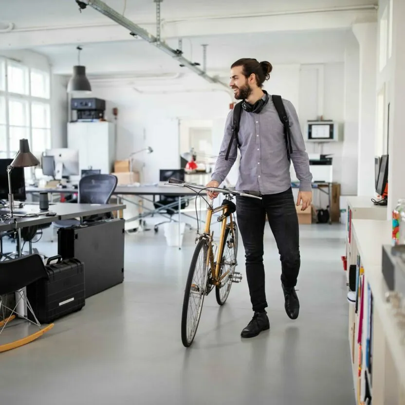 Businessman with a bicycle in office