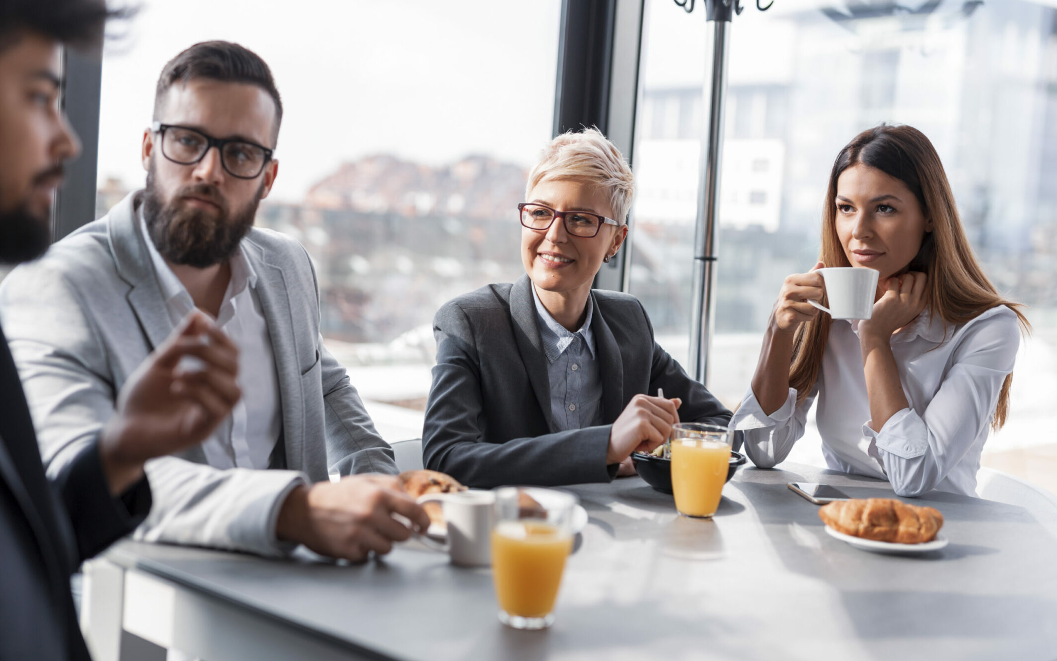 Business people having Breakfast in an office