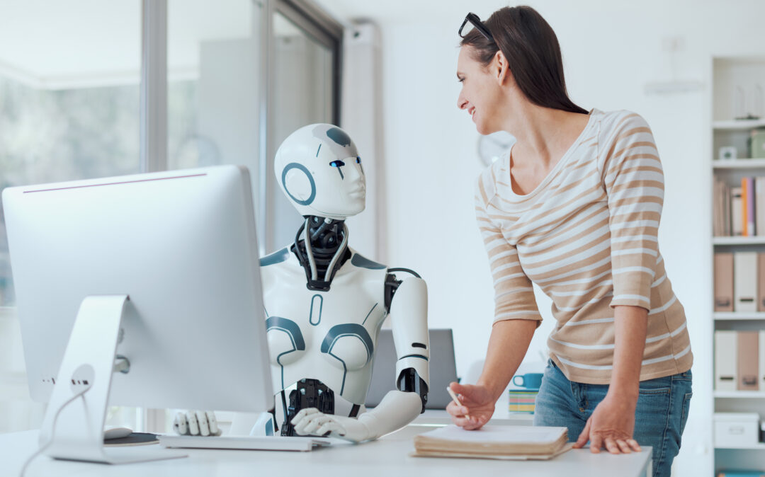 Woman and AI robot working together in the office, automation and technology concept - KI Beratung & Strategie
