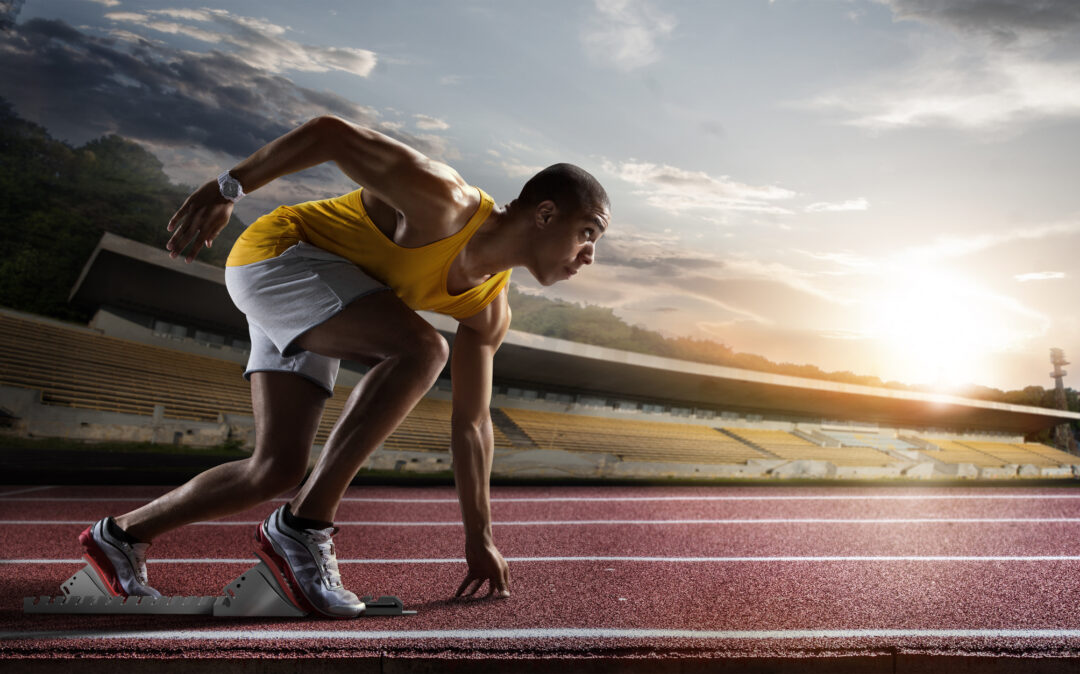 Sport. Sprinter leaving starting blocks on the running track. | KI-Consulting & Strategy