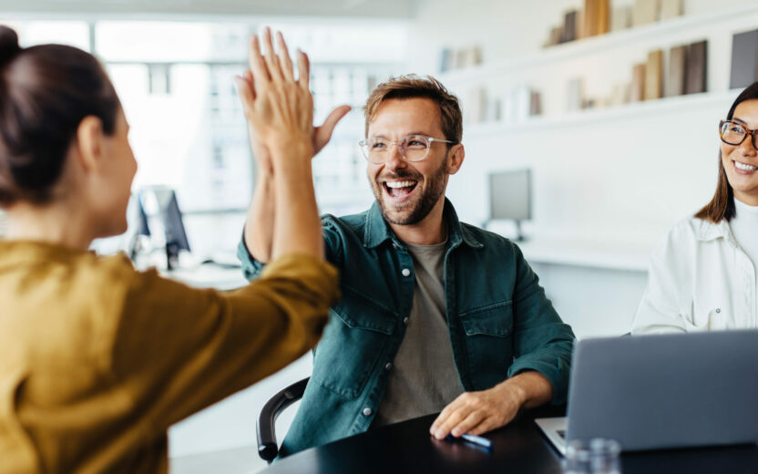 Business people celebrating success in an office