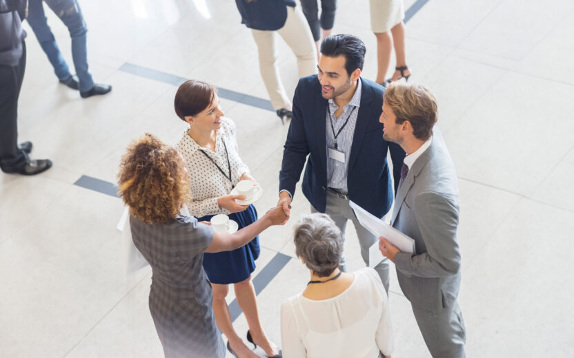 High angle view of group of business people shaking hands