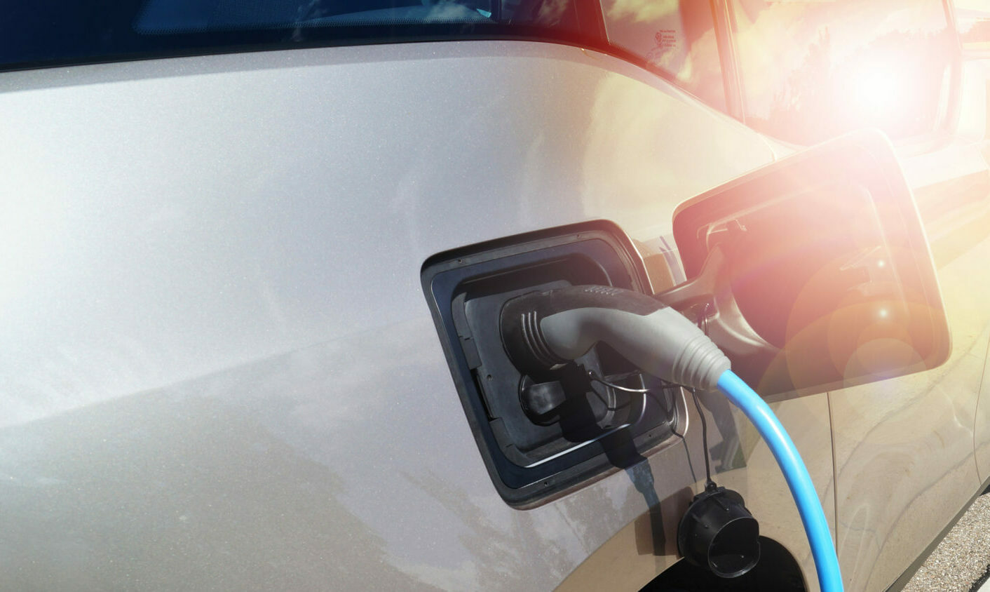 Electric Car Power Supply charging on charge station electro mobility environment friendly copy space