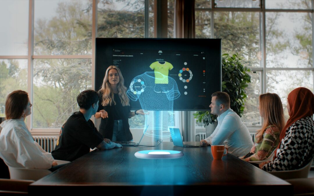 Colleagues in a meeting with a hologram on the table