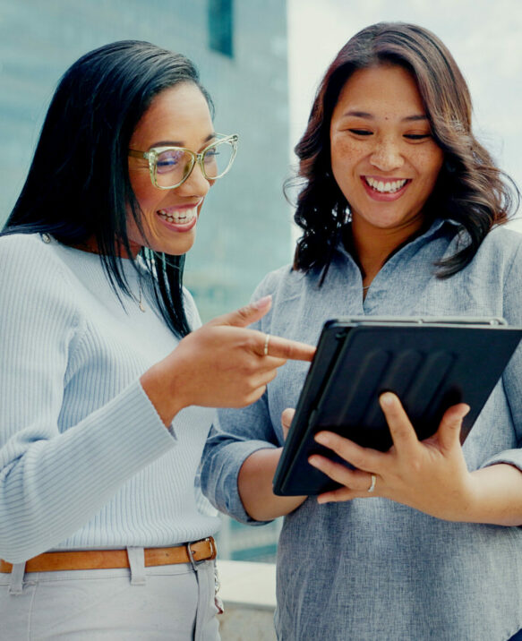 Tablet, partnership teamwork and happy people on balcony review social network, customer experience or business ecommerce. Brand monitoring data, talking and women teamwork on online survey feedback.