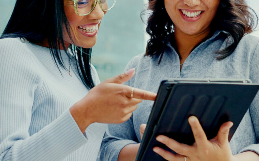 Tablet, partnership teamwork and happy people on balcony review social network, customer experience or business ecommerce. Brand monitoring data, talking and women teamwork on online survey feedback.