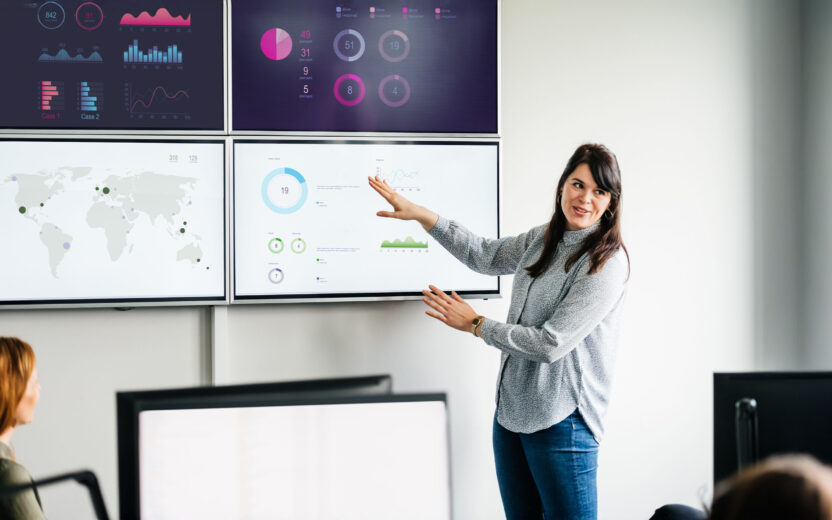 Businesswoman explaining graphs and data