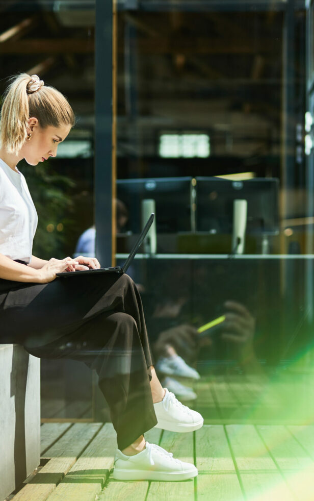 valantic employee looking at her laptop