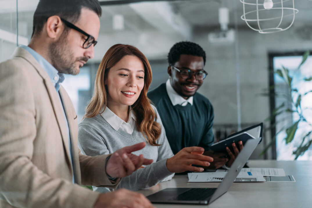 Business woman explaining business plan on laptop
