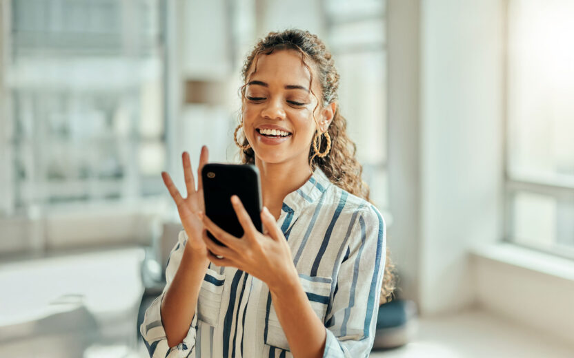 Woman typing on a phone
