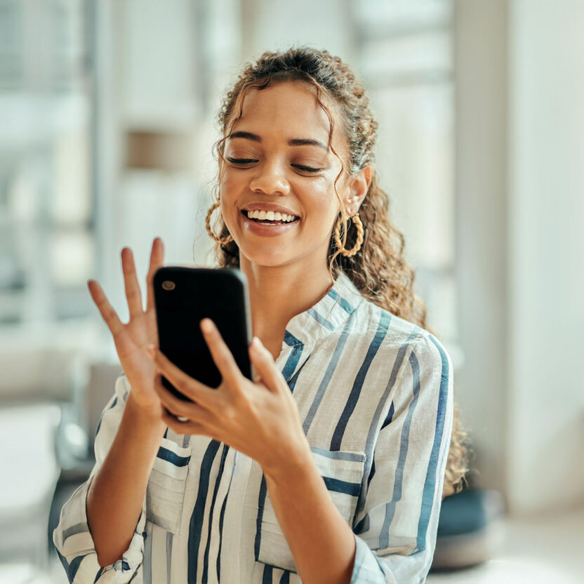 Woman typing on a phone