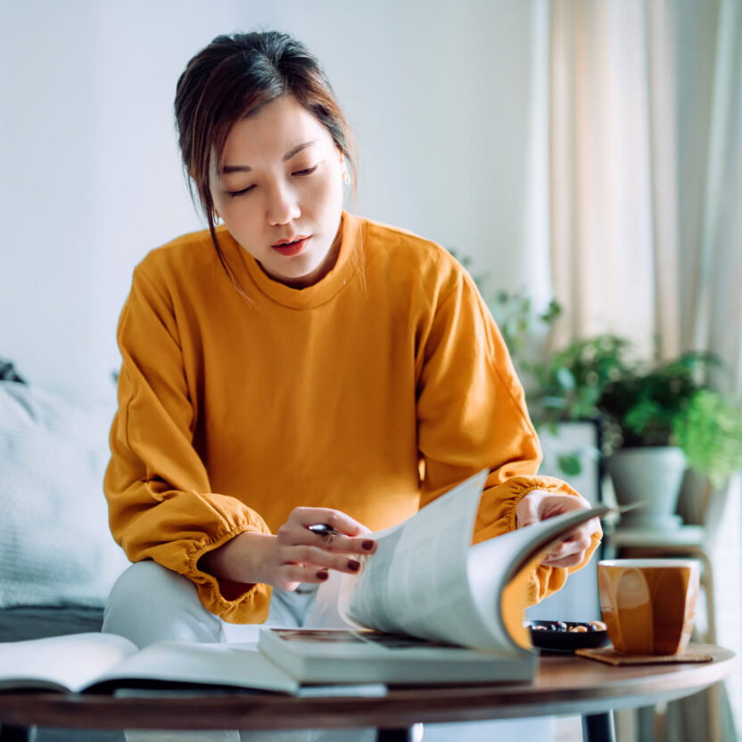 focused-young-woman-reading-book