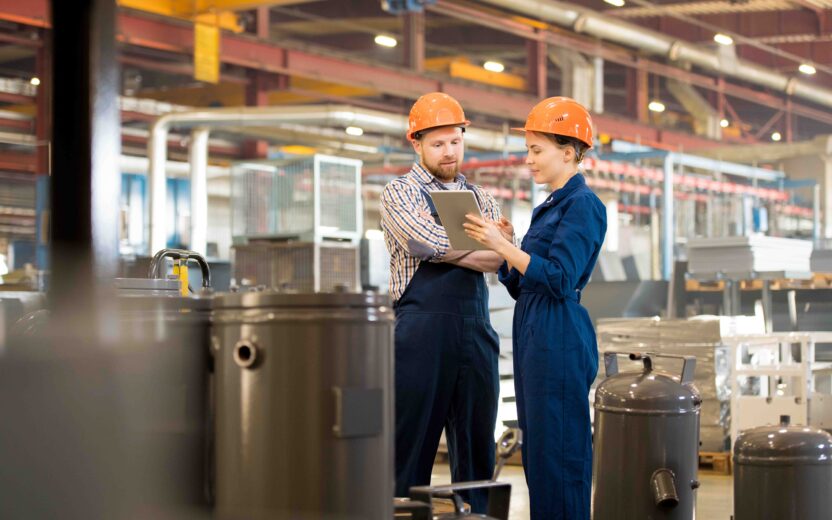 Two maintenance workers in a stock environment