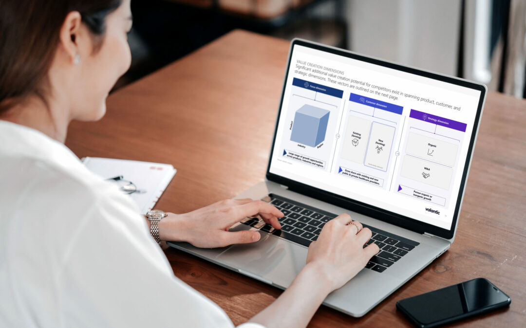 Woman hands work with laptop showing slide on value creation within the healthcare it services dach market.