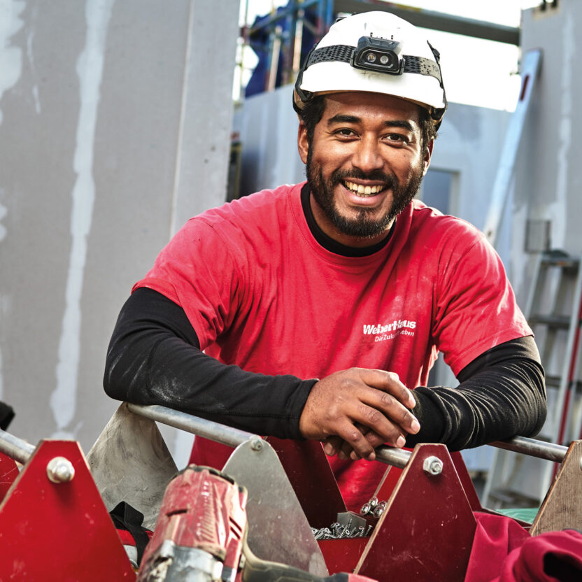 Weberhaus GmbH & Co KG: Handwerker auf der Baustelle