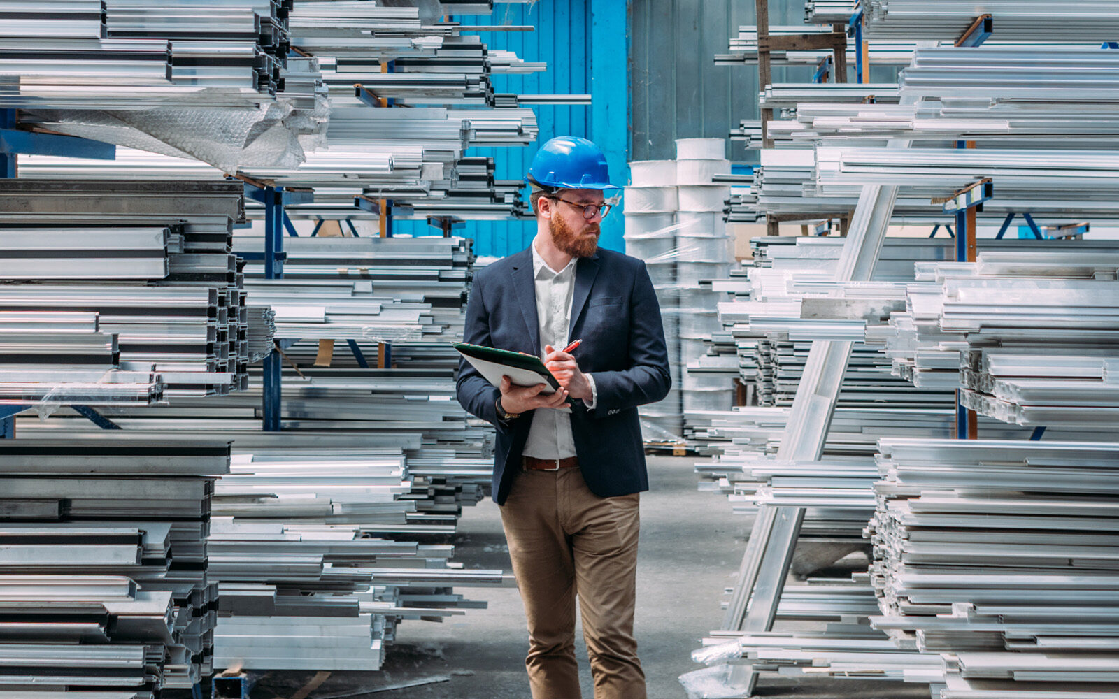 Man in a warehouse checking stocks there