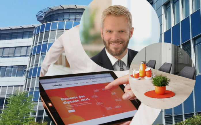 Bild von Thomas Latajka, Geschäftsführer valantic ERP, Bürogebäude in Langenfeld, Konferenzraum, Tablet mit valantic Website