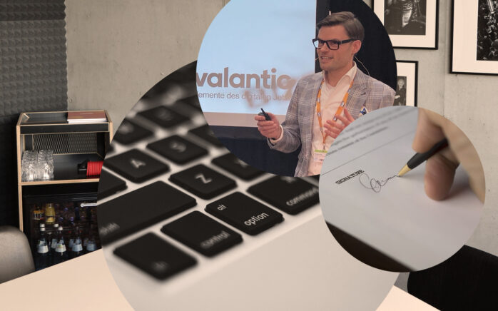 Bild von Matthias Bös, Solution Architect für SAP C/4HANA bei valantic Customer Engagement and Commerce, Laptop Tastatur, Unterschrift, Konferenzraum
