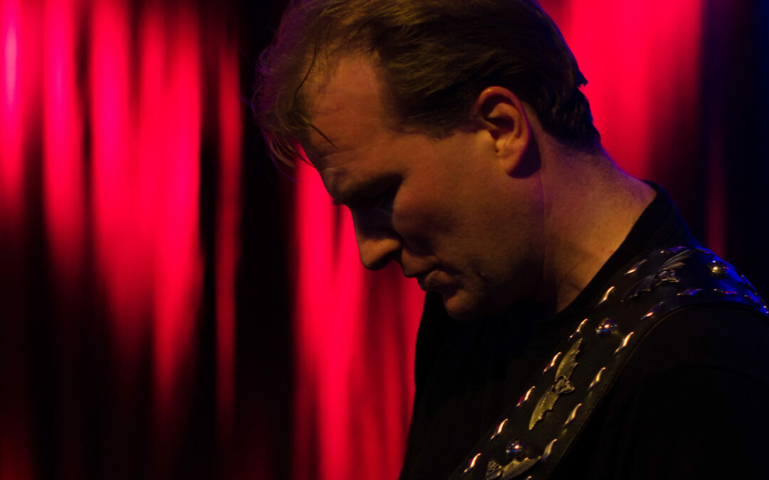Picture of Jörg Wassink, Director Marketing & Communications at valantic, playing guitar