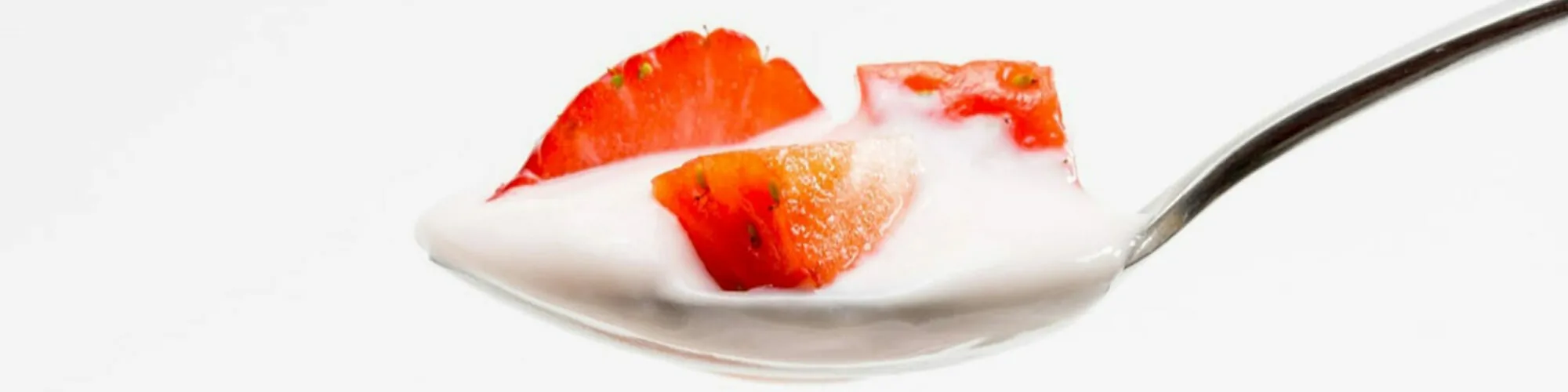 Picture of a spoon with yoghurt and strawberries, valantic Case Study Müller