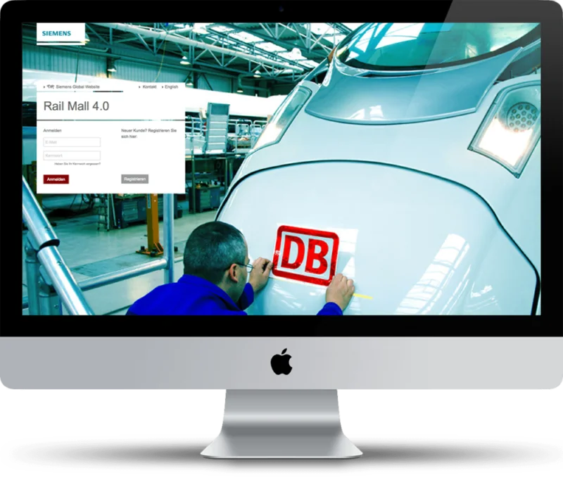 Bild eines Rechners, auf dem Bildschirm ein Mann beim Bekleben eines Zuges mit dem DB-Logo, valantic Case Study Siemens