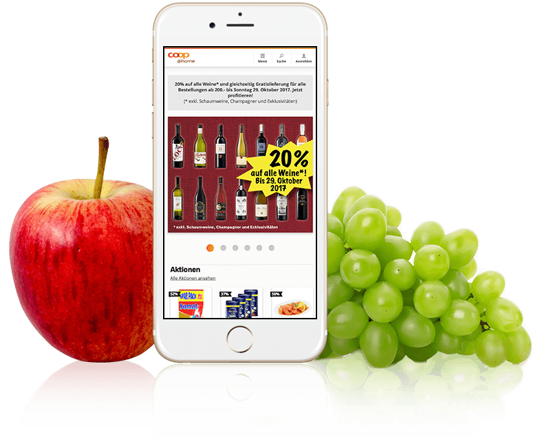 picture of a smartphone between an apple and grapes with coop@home on the screen, valantic Case Study coop@home, SAP Commerce Cloud