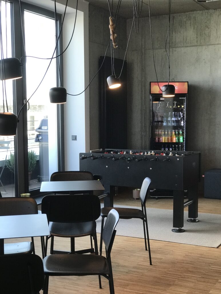 Image of a lounge with a foosball table, office of valantic Customer Engagement & Commerce (CEC) in Mannheim