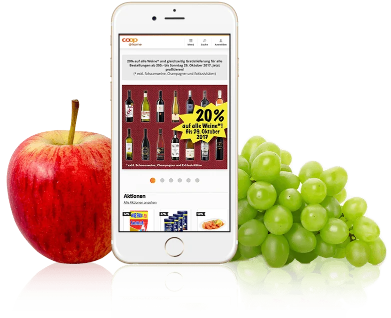 Bild von einem Smartphone mit coop@home auf dem Bildschirm, daneben liegen ein Apfel und Trauben, valantic Case Study coop@home