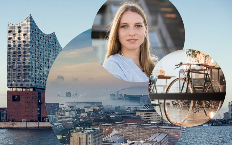 Image of Kirsten Nachtmann, Consultant SAP Business Intelligence (BI) at valantic Business Analytics in Hamburg, in the background the Elbphilharmonie in Hamburg as well as the skyline and a bike in the office