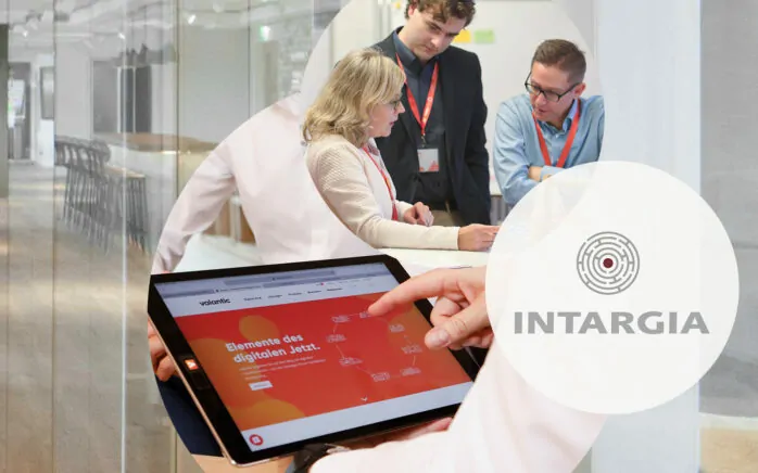 This images shows three pictures in circles: a logo of management consultancy Intargia, who have joined valantic, valantic employees in a meeting and a tablet.